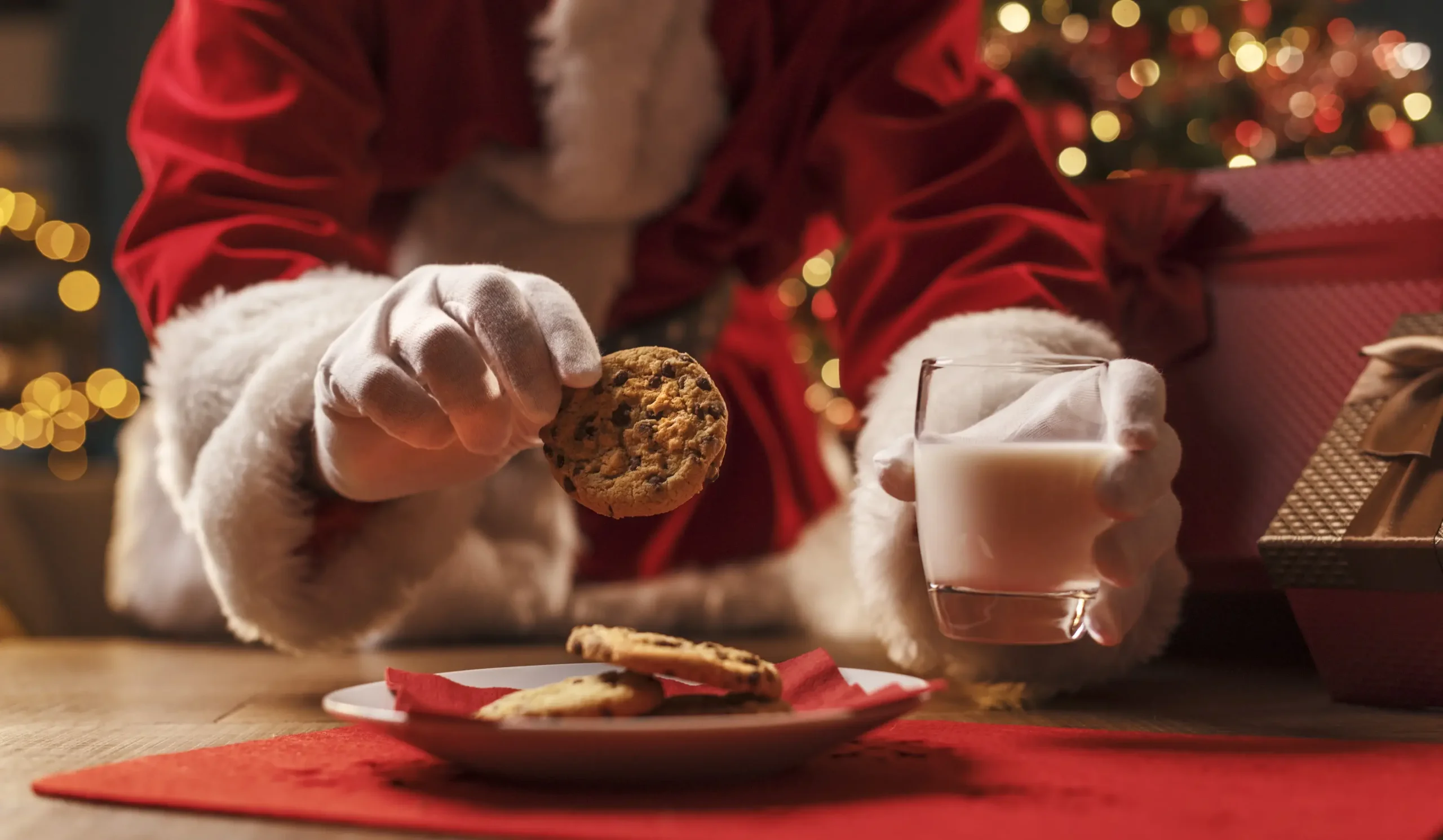 Child meeting Santa Claus during a festive family breakfast